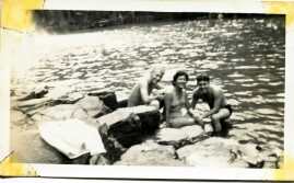 photo of girl on rock at beach